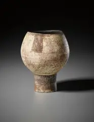 Footed pot by Hans Coper, circa 1956, Stoneware, the textured body with patches of red and manganese 'flag' designs, sold Oct 2015