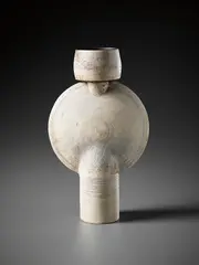 Composite form with vertical central disc by Hans Coper, circa 1974, Stoneware, layered white porcelain slips and engobes over a body with textured and incised linear designs, the interior , sold Oct 2015
