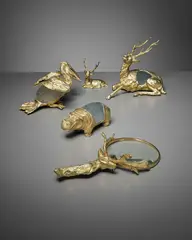 Gabriella Crespi, Group of animal sculptures and magnifying glass, circa 1974, Gold-plated cast brass, glass