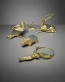Gabriella Crespi, Group of animal sculptures and magnifying glass, circa 1974, Gold-plated cast brass, glass