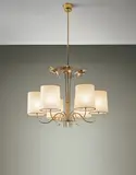Six-armed chandelier by Paavo Tynell, 1950s, Brass, perforated brass, opaque glass, parchment shades, offered Oct 2015