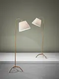 Pair of standard lamps, model no. 6096 by Paavo Tynell, circa 1953, Painted metal, cane wrapped tubular brass, tubular brass, brass, fabric shades, sold Oct 2015