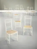 Erik Chambert, Set of ten 'Poem' chairs, designed 1953, executed 1950s, Painted wood, cane