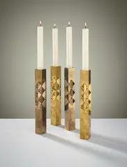Pierre Forsell, Set of four candlesticks, 1960s, Brass