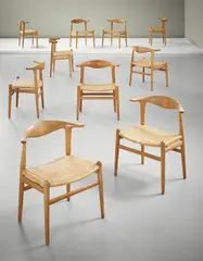 Hans J. Wegner, Set of ten 'Cowhorn' chairs, model no. JH 505, circa 1952, Oak, cane