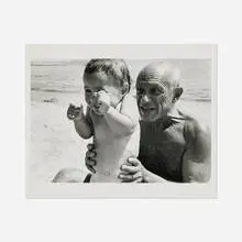 Pablo Picasso and his son Claude at the beach, Golfe-Juan, France by Robert Capa, gelatin silver print, sold Dec 2024