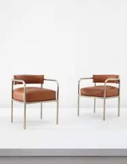 René Herbst, Pair of armchairs, circa 1928, Nickel-plated tubular metal, leather