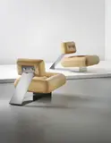Oscar Niemeyer, Pair of 'Aran' lounge chairs, circa 1975, Leather, stainless steel