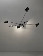 Serge Mouille, Rare seven-armed wall light with 'Casquette' shades, 1953-1958, Painted tubular metal, painted aluminium, brass
