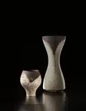 Hans Coper, Early pot with dark rim, circa 1956, Stoneware, layered with porcelain slips and englobes over a body with textured designs, the interior with manganese glaze