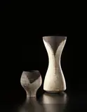 Hans Coper, Early tall vase with dark rim, circa 1956, Stoneware, layered with porcelain slips and englobes over a body with textured designs, the interior with manganese glaze
