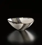 White oval bowl with gold band by Lucie Rie, circa 1980, Porcelain with matte white and golden manganese glazes, with a band of sgrafitto design, sold Sep 2014