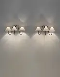 Jean Royere, Pair of three-armed ‘Bouquet’ wall lights, circa 1950, Painted tubular metal, paper shades