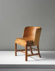 Kaare Klint, Important and rare desk chair, model no. 5121, designed for the Crown Prince Frederik IX of Denmark and Princess Ingrid of Sweden, Copenhagen, 1935, Cuban mahogany, Niger leather