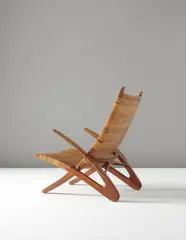 Hans J. Wegner, Rare 'Dolphin' folding armchair, model no. JH510, 1950, Oak, cane, brass
