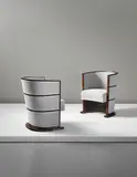 Axel Einar Hjorth, Important and unique pair of armchairs, 1928, Macassar ebony-veneered wood, mahogany, fabric