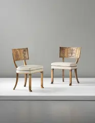 Axel Einar Hjorth, Pair of chairs, from the 'Caesar' series, circa 1927, Flamed birch, carved flamed birch, fabric