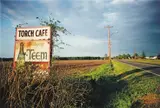 Untitled, Mississippi, (Torch Cafe Billboard) by William Eggleston, 1973, Dye transfer print from Dust Bells , Volume II , printed 2004, sold Nov 2013