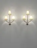 Jean Royere, Pair of ‘Persane’ three-armed wall lights, circa 1953, Painted and gilded tubular metal, painted and gilded metal, paper shades (2)