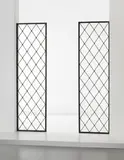 Jean Royere, Pair of ‘Tour Eiffel’ room dividers, circa 1950, Painted tubular metal, painted metal, brass (2)