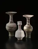 Lucie Rie, Vase with flaring neck, circa 1970, Mixed clays thrown together producing an integral pink/brown and cream spiral in the glaze
