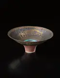 Conical bowl by Lucie Rie, circa 1979, Porcelain, golden manganese glaze with turquoise ring and terracotta well, sold Apr 2013