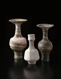 Lucie Rie, Tall vase with flaring neck, circa 1980, Mixed clays thrown together producing an integral pink and green spiral in the heavily pitted glaze