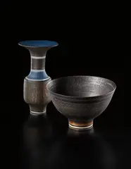 Bowl by Lucie Rie, circa 1961, Porcelain, manganese with sgraffito and blue well, sold Apr 2013