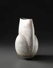 Ovoid pot with flattened and raised neck by Hans Coper, circa 1968, Stoneware, layered white porcelain slips and engobes over a body with textured and incised linear designs, the interior , sold Apr 2013