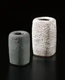Lucie Rie, Squared flower vase, circa 1966, Stoneware, white pitted and flowing glaze, manganese elements in the body creating a brown speckle