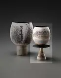 Hans Coper, Composite cup and disc form, circa 1974, Stoneware, layered white porcelain slips and engobes over a body with textured, and incised linear designs, the interior and disc with manganese glaze