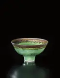 Bowl by Lucie Rie, circa 1982, Porcelain, green glaze with golden lip, sold Apr 2013
