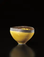 Lucie Rie, Oval bowl, circa 1976, Porcelain, yellow and manganese glazes with sgraffito band