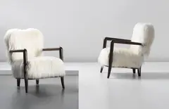 Jean Royere, Pair of ‘Trefle’ armchairs, commissioned by the Legation de France, Helsinki, 1950, Ebonised wood, faux goatskin