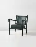 Jacques Adnet, Low armchair, 1950s, Leather-covered tubular metal, leather-covered metal, leather, brass