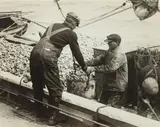 Removing Oysters in Bushel Buckets from the Dredging Boats by A. Aubrey Bodine, Silver gelatin print, offered Jun 2013