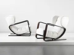 Piero Bottoni, Unique pair of wingback lounge chairs, commissioned for the Casa Minerbi, Ferrara, circa 1936-1937, Macassar ebony, fabric