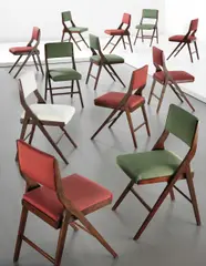 Piero Bottoni, Set of twelve dining chairs, commissioned for the Casa Minerbi, Ferrara Casa Minerbi, Ferrara, 1950, Stained wood, fabric