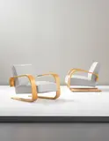 Pair of 'Tank' armchairs, model no. 400 by Alvar Aalto, circa 1935-1936, Bent birch laminated plywood, fabric, sold Sep 2013