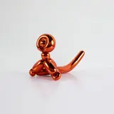 Jeff Koons, Balloon Monkey (Orange), 2017, Porcelain multiple painted in chrome, contained in the original Styrofoam-lined presentation box with silver printed signature