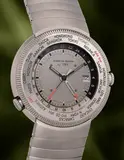 Iwc, A titanium “Reiseuhr” world time wristwatch with centre seconds, date, alarm, power reserve, bracelet and presentation box, 1998, Switzerland