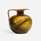 Standard Glaze pitcher with ear of corn by Mary Louella Perkins for Rookwood Pottery, 1893, glazed earthenware, sold Nov 2023