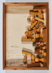 Accumulation by Arman, 1973, assemblage of rubber stamps in a pine and plexiglas shadowbox, sold Nov 2021