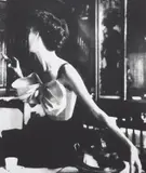 Lillian Bassman, Across the Restaurant, Barbara Mullen, dress by Jacques Fath, Le Grand Véfour, Paris, 1949, Tirage argentique postérieur