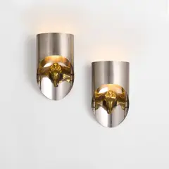 Pair of 'Totem' wall lights by Maria Pergay, circa 1974, Stainless steel, bronze, sold Jun 2022