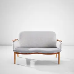 Two-seater sofa by Finn Juhl, circa 1953, Teak, fabric, brass, sold Nov 2022