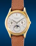 Patek Philippe, A rare and attractive yellow gold perpetual calendar wristwatch with German calendar, moon phases, 24-hour indication, leap year indication, Certificate of Origin and presentation box