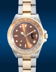 Rolex, A fine and rare two-tone stainless steel and yellow gold dual-time wristwatch with center seconds, date, bracelet, guarantee and presentation box, Circa 2004