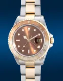 Rolex, A fine and rare two-tone stainless steel and yellow gold dual-time wristwatch with center seconds, date, bracelet, guarantee and presentation box, Circa 2004