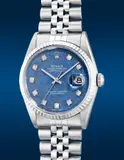 Rolex, A fine and attractive stainless steel wristwatch with center seconds, date, blue sodalite dial, diamond-set indexes, white gold bezel, bracelet and guarantee, Circa 2000
